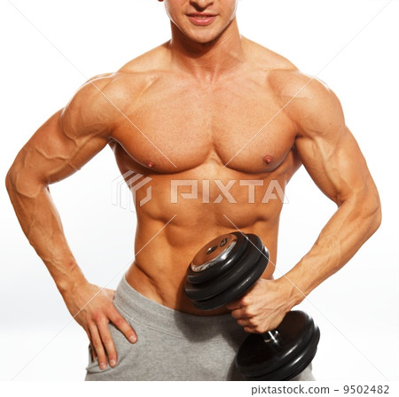 Handsome young muscular man exercising with dumbbells 9502482