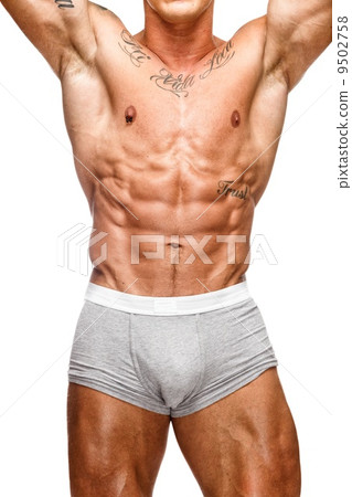 Man with beautiful muscular tattooed torso in underwear 9502758