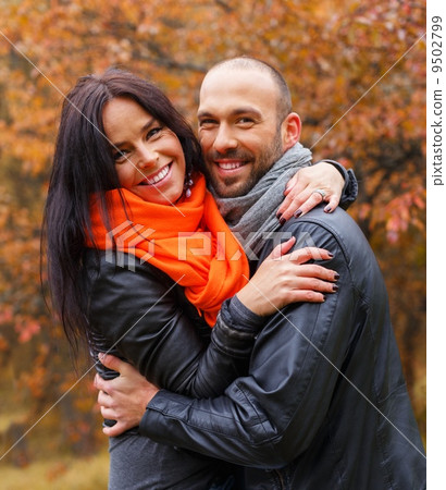 Happy middle-aged couple outdoors on beautiful autumn day 9502799
