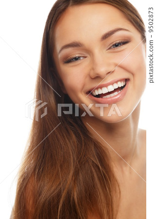 Young positive brunette girl with beautiful smile 9502873