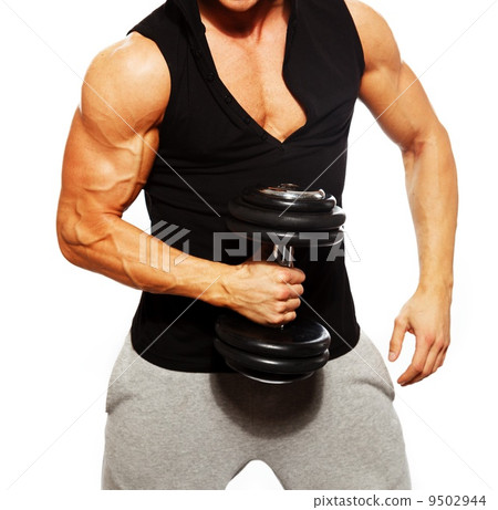 Handsome man with muscular torso and dumbbell Handsome man with muscular torso and dumbbell 9502944