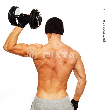 Handsome young muscular man exercising with dumbbells 9503119