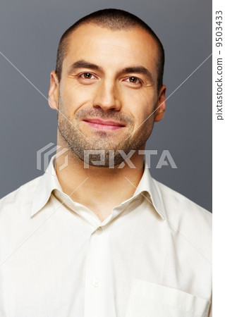 Handsome man in white shirt isolated on grey background Handsome man in white shirt isolated on grey background 9503433