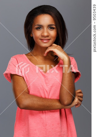 Cheerful young black woman isolated on grey background Cheerful young black woman isolated on grey background 9503439