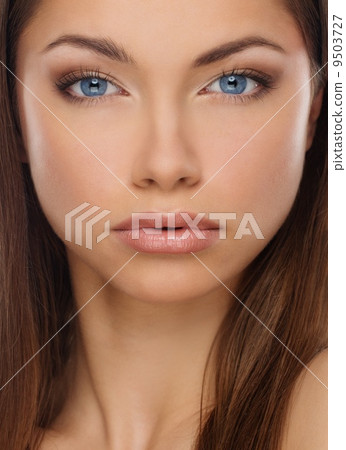 Beautiful young brunette woman with blue eyes Beautiful young brunette woman with blue eyes 9503727