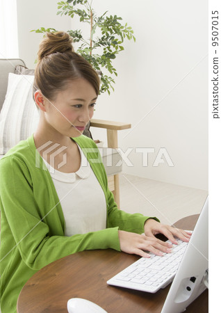 Young woman teleworking remote work at home 9507015