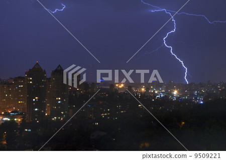 Lightening strikes a city at night in Kiev Lightening strikes a city at night in Kiev 9509221