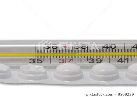 close up of used pills blister and thermometer close up of used pills blister and thermometer 9509229