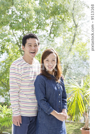 A couple with a smiling face standing cuddly A couple with a smiling face standing cuddly 9513168