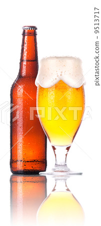 Frosty glass of beer with bottle isolated Frosty glass of beer with bottle isolated 9513717