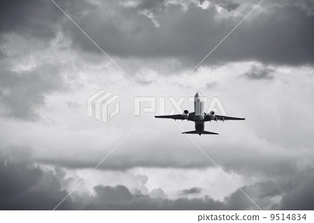 Airplane in the bad weather. 9514834