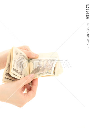 A woman counting money 9516173