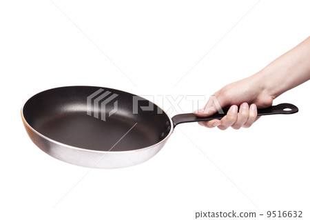 Woman's hand holding a frying pan 9516632