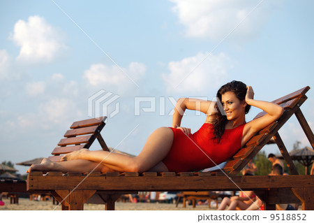 Hot brunette in red swimsuit 9518852