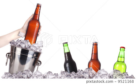 frosty beer with ice bucket and hand frosty beer with ice bucket and hand 9521168