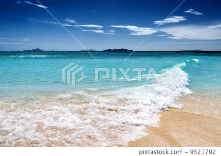 White sand beach and blue sky 9521792
