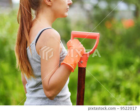Woman working in the garden 9522017