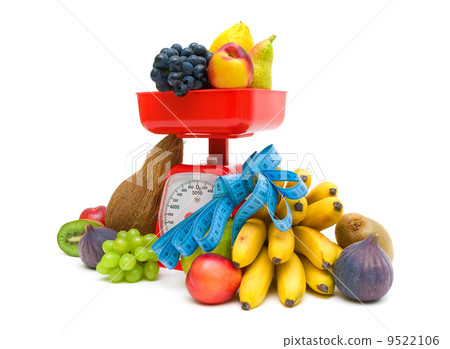 fruit, kitchen scale and measuring tape on a white background fruit, kitchen scale and measuring tape on a white background 9522106