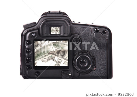 Photo camera with money on a screen Photo camera with money on a screen 9522803