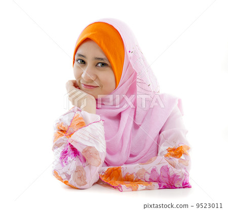 malay muslim girl closeup in headscarf and white background malay muslim girl closeup in headscarf and white background 9523011