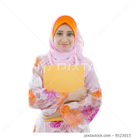 malay indonesian college girl holding a folder with white backgr malay indonesian college girl holding a folder with white backgr 9523015
