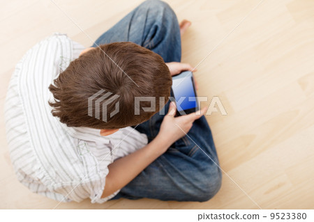 Child with smart phone Child with smart phone 9523380