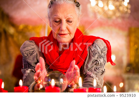 Soothsayer during esoteric session with Crystal ball 9523910