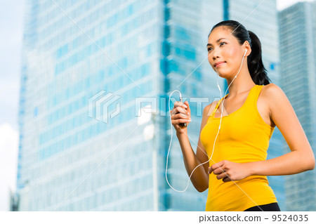 Urban sports - fitness in Asian or Indonesian city Urban sports - fitness in Asian or Indonesian city 9524035