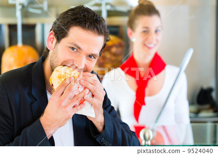 Kebab - customer and hot Doner with fresh ingredients 9524040