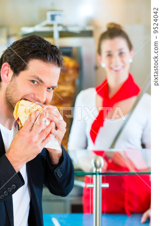 Kebab - customer and hot Doner with fresh ingredients 9524042