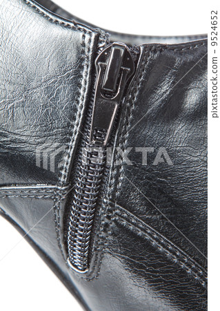 zipper fastener on the leather shoes. Closeup. 9524652
