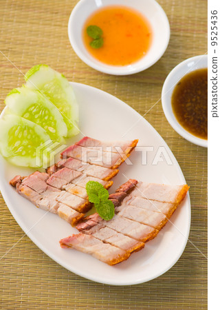 chinese roast pork close up shot served with chilli sauce chinese roast pork close up shot served with chilli sauce 9525436