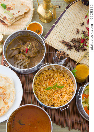 Biryani basmati mutton rice with traditional items on background 9529583