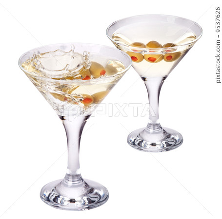 martini with olive splashing isolated martini with olive splashing isolated 9537626