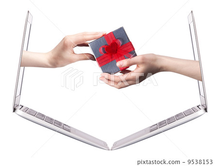 hand with a gift and laptop 9538153