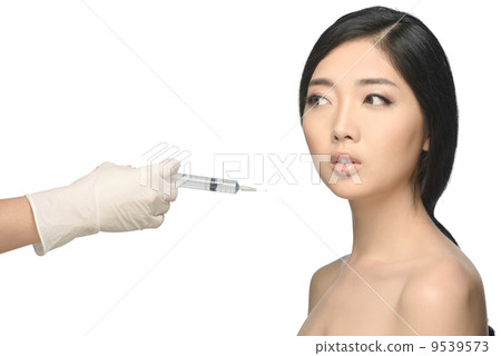 Beauty shot young woman botox injection studio isolated white background Beauty shot young woman botox injection studio isolated white background 9539573