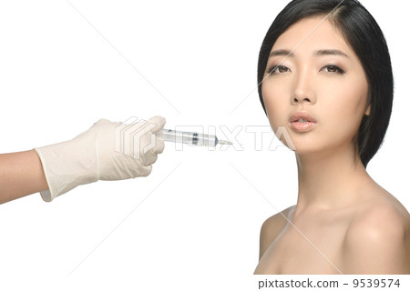 Beauty shot young woman botox injection studio isolated white background Beauty shot young woman botox injection studio isolated white background 9539574