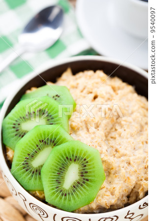 Bowl of oats porridge with kiwi Bowl of oats porridge with kiwi 9540097