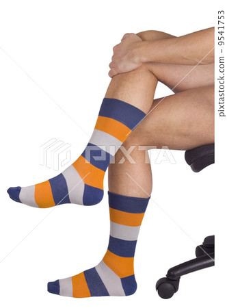 Male legs in colorful socks. Isolated on white Male legs in colorful socks. Isolated on white 9541753