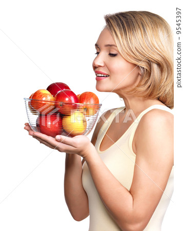 Portrait of a young woman with apples. Portrait of a young woman with apples. 9545397