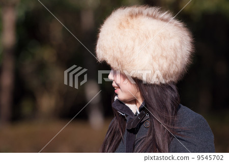 A woman wearing a fur cap A woman wearing a fur cap 9545702