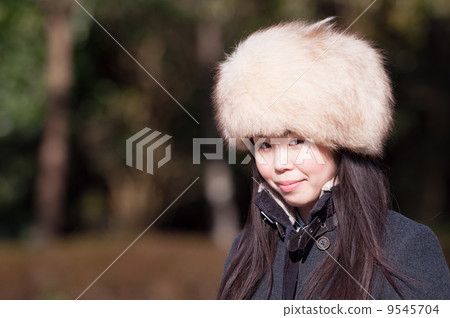 A woman wearing a fur cap A woman wearing a fur cap 9545704