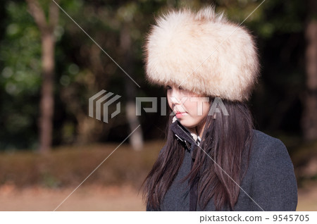 A woman wearing a fur cap A woman wearing a fur cap 9545705