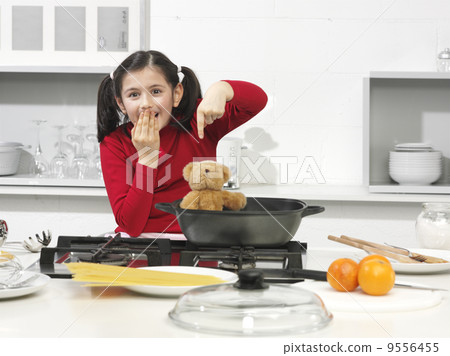 ..little girl in the kitchen with his bear ..little girl in the kitchen with his bear 9556455