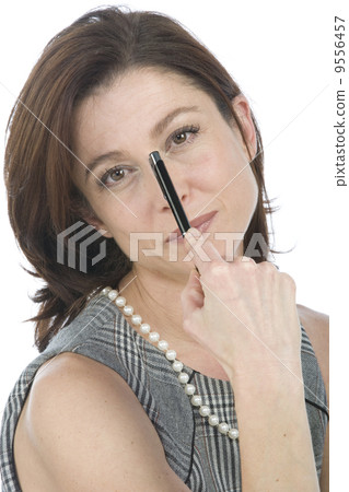 Portrait of happy businesswoman with a pen in hand Portrait of happy businesswoman with a pen in hand 9556457