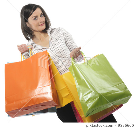 .portrait of one happy young adult girl with colored bags.. .portrait of one happy young adult girl with colored bags.. 9556660