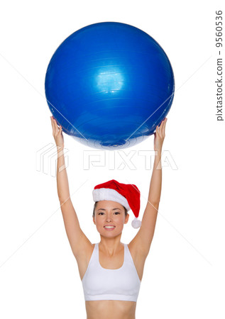 Asian girl with a ball in his raised hands Asian girl with a ball in his raised hands 9560536