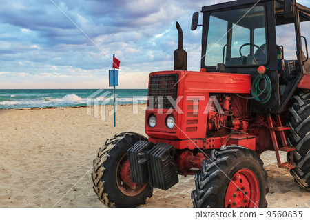 tractor on the sandy beach tractor on the sandy beach 9560835