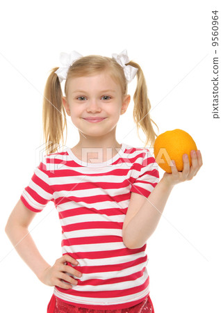 girl holding an orange and smiling girl holding an orange and smiling 9560964