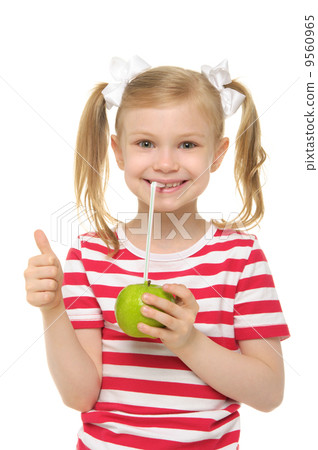 Girl drinking apple juice through straw Girl drinking apple juice through straw 9560965